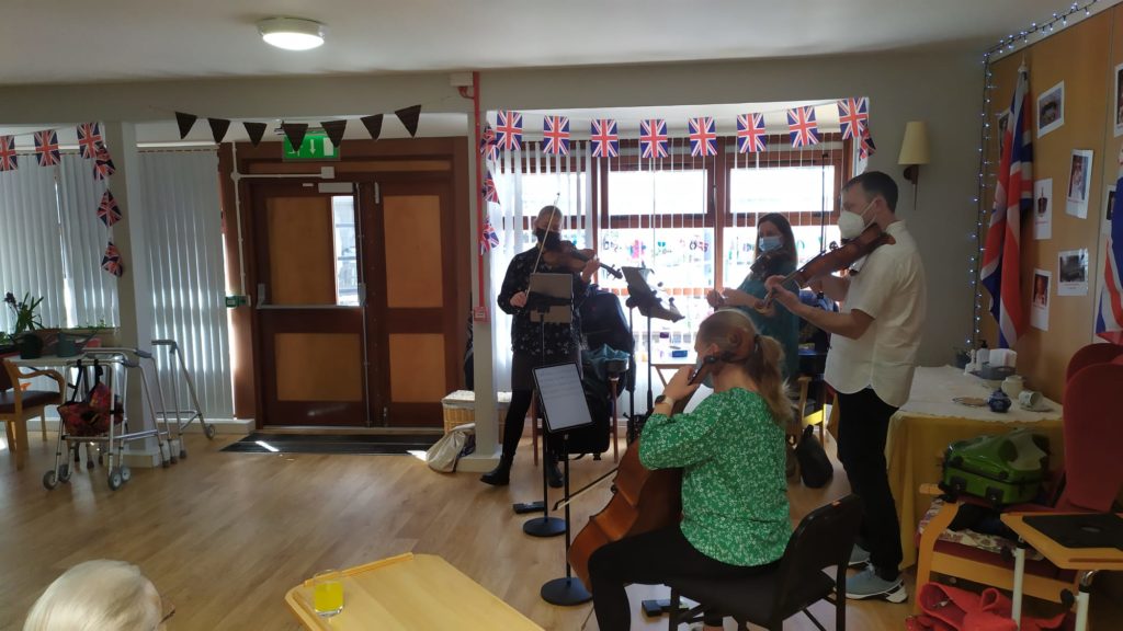 Quartet of musicians performing at a care home